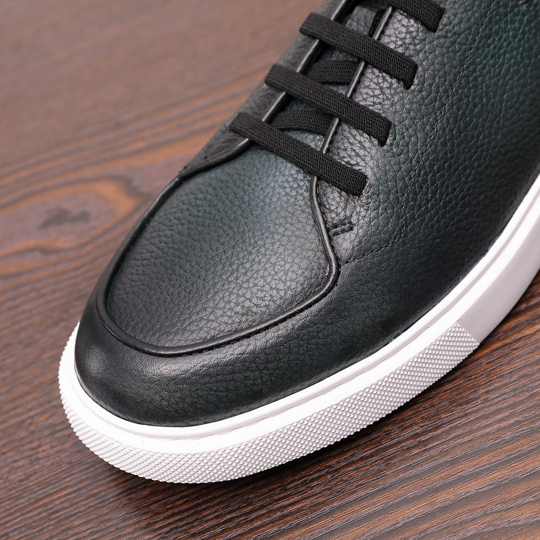 Dark green genuine leather sneaker with lace-up closure and rounded toe, white rubber sole.