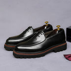 Men's chunky lug-sole oxfords, black leather with brown edge trim and lace-up
