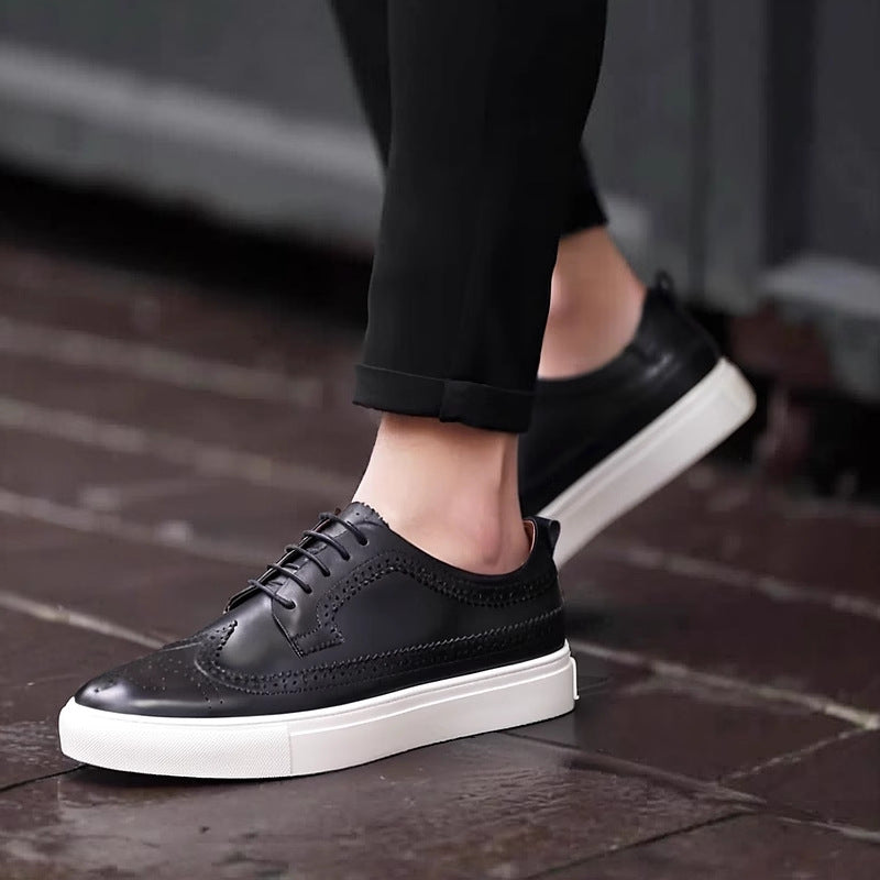 Men's genuine leather sneakers, black lace-up with perforated toe and white sole.