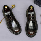 Men's leather pointed-toe derby shoes, lace-up front with brogue detailing and dark finish.