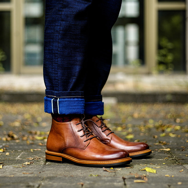 Men's dark brown leather lace-up chukka boots, plain toe, stitched panel and tan outsole