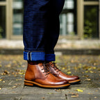 Men's dark brown leather lace-up chukka boots, plain toe, stitched panel and tan outsole