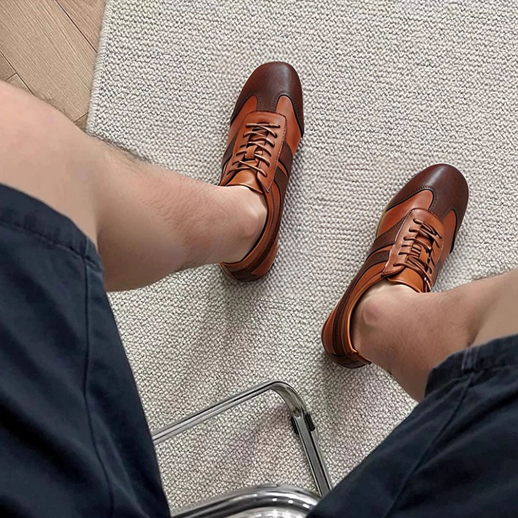 Men's brown leather sneakers with lace-up front and cushioned ankle collar