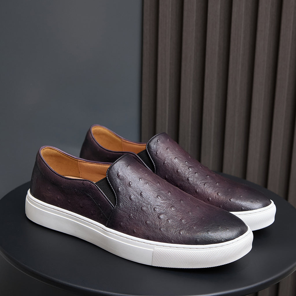 Men's dark purple slip-on leather sneakers with white rubber sole and textured leather