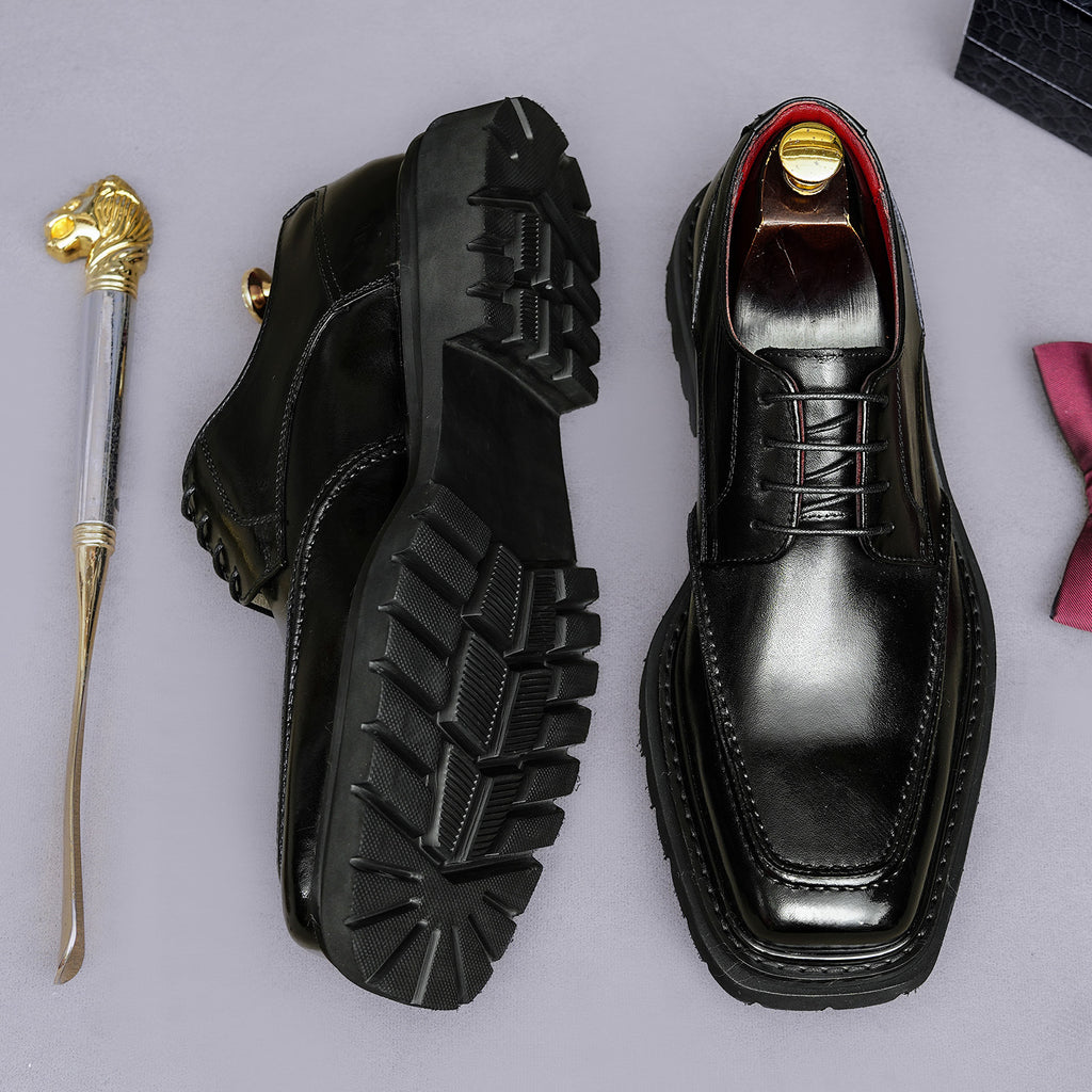 Men's chunky lug-sole wingtip brogue oxford shoes, black, lace-up front and sole view.