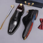 Black wingtip brogue oxford shoes with chunky lug sole, lace-up pair with blue lining