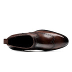 Brown leather slip-on chelsea dress boot with wingtip brogue detailing