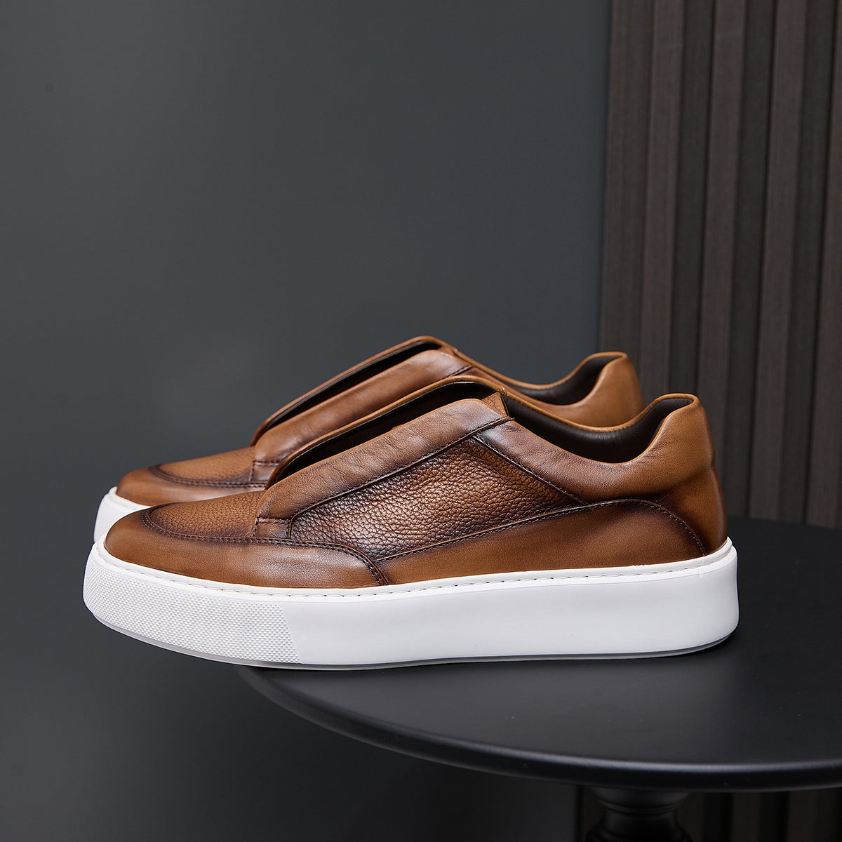 Brown genuine leather low-top sneakers with stitched side panel and white rubber sole