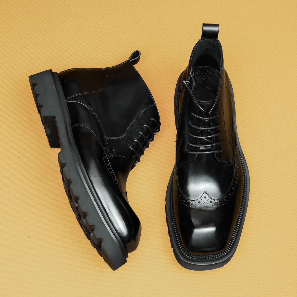 Black leather lace-up ankle boots with side zipper, thick sole, and brogue toe