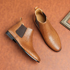 Brown woven leather chelsea boots with side elastic panels and low stacked heel