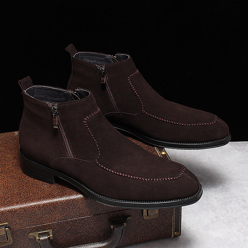 Brown suede side-zip ankle boots on display, stitched toe and thick sole