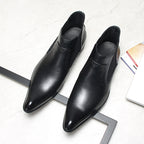 Men's black leather Chelsea dress boots, pair view, slip-on with elastic side gores