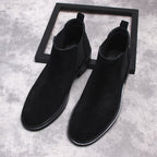 Men's black Chelsea dress boots, front view of slip-on ankle boot with elastic sides