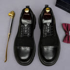 Black leather lace-up wingtip brogue oxfords with chunky lug sole