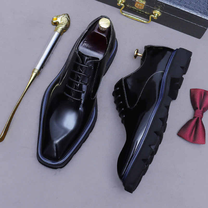 Men's black wingtip brogue oxford shoes, lace-up front and side view, lug sole