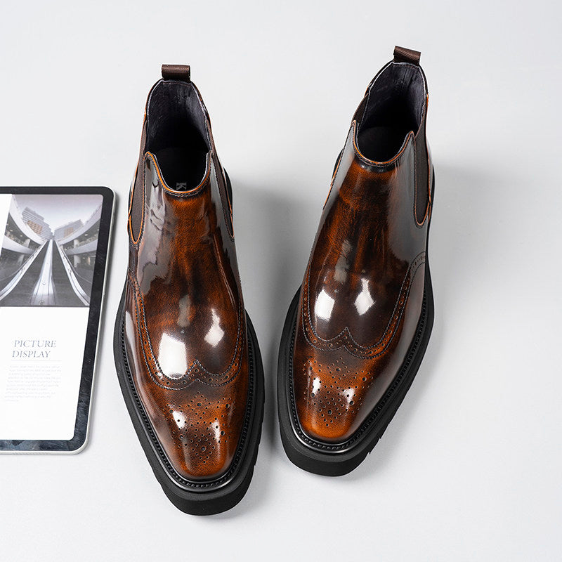 Dark brown leather Chelsea dress boots, glossy finish with brogue perforation and elastic gore