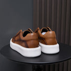 Brown leather sneakers back view with white platform soles