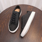 Men's genuine leather sneakers, side view, dark upper with black laces and white sole