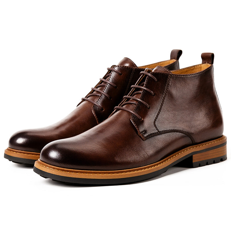 Men's dark brown leather chukka boots with plain toe, lace-up closure, and treaded sole
