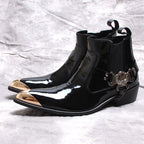 Black glossy Chelsea dress boots with slip-on gore and ornamental buckle on the side.