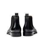 Black leather chelsea dress boots with pull tabs and low stacked heel