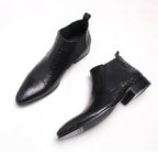 Black leather Chelsea boots, slip-on style with elastic side panels