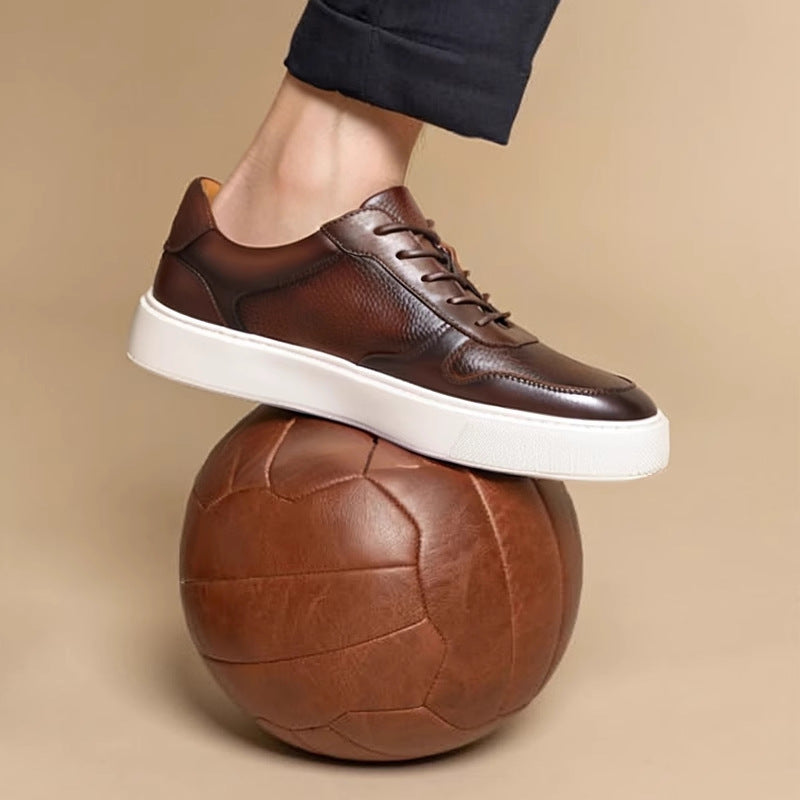 Men's dark brown leather sneakers with lace-up front and white rubber sole