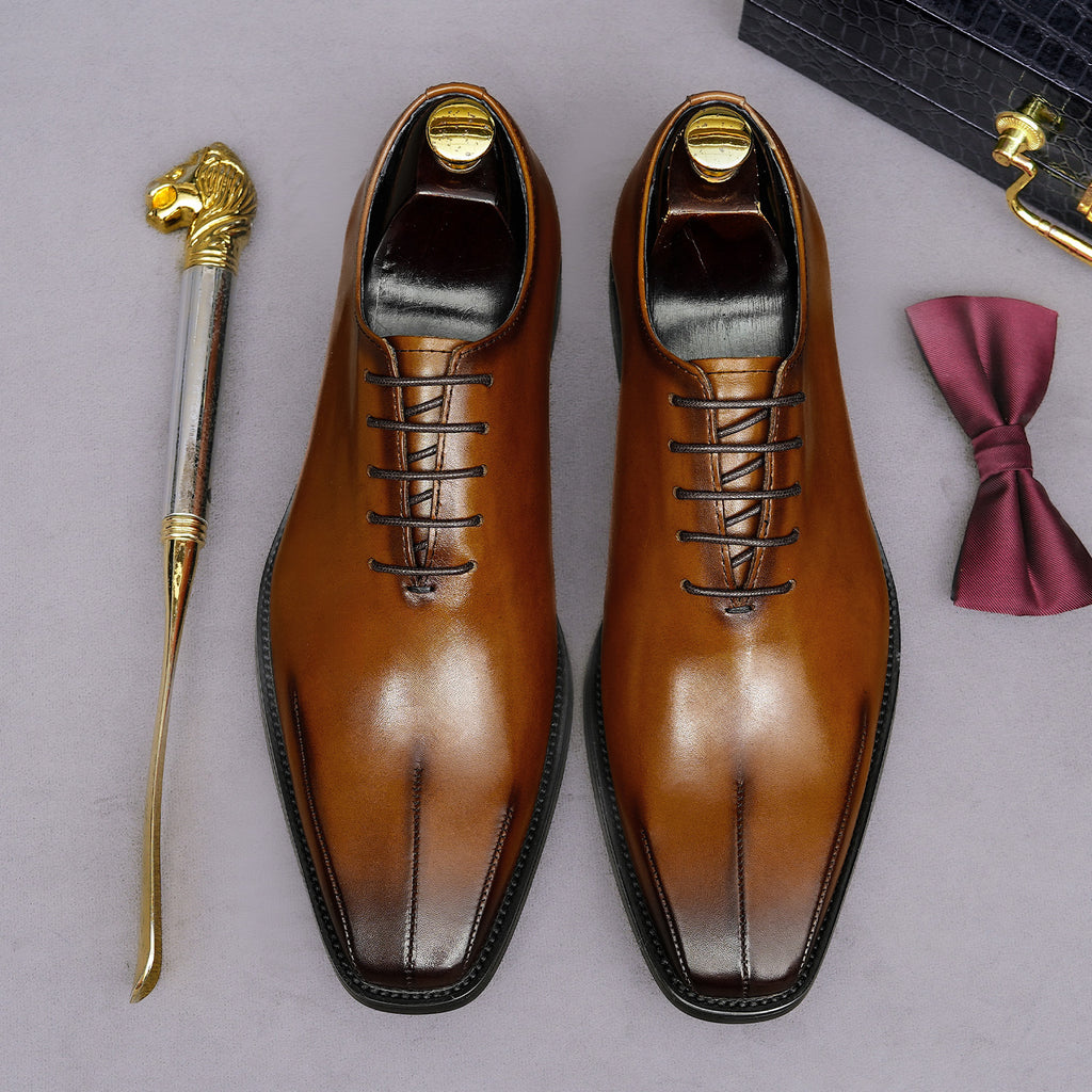 Men's brown wingtip brogue oxfords, top view with lace-up details