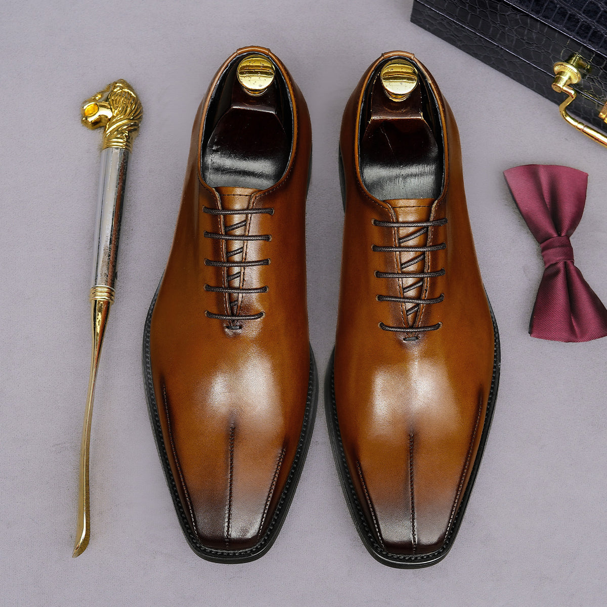 Men's brown wingtip brogue oxfords, top view with lace-up details