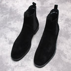 Black suede Chelsea dress boots with elastic side panels and pull tab
