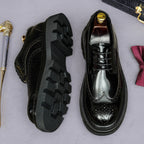 Men's leather derby shoes shown with side tread soles and lace-up pointed-toe design.