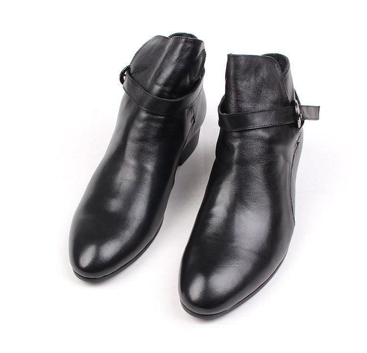 Black leather pointed-toe dress boots with side buckle strap, ankle height.