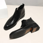 Men's black leather side-zip ankle boots with embossed finish and thick outsole