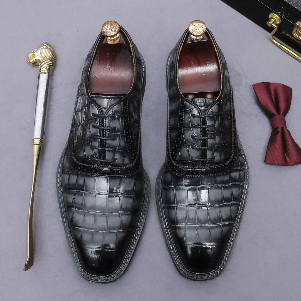 Men's black wingtip brogue oxford shoes with chunky lug sole, lace-up front view