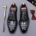 Men's black wingtip brogue oxford shoes with chunky lug sole, lace-up front view