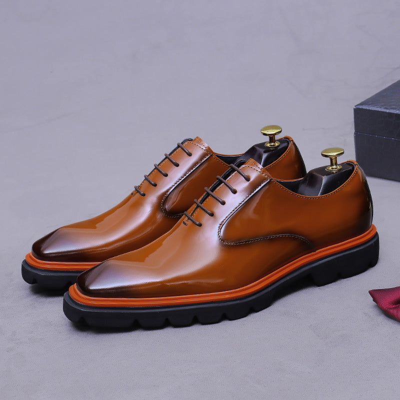 Men's brown wingtip brogue oxford shoes, 3/4 view, chunky lug sole