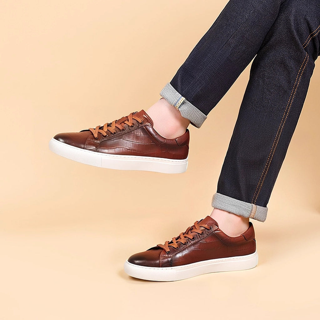 Men's brown leather lace-up sneakers with textured upper and white sole