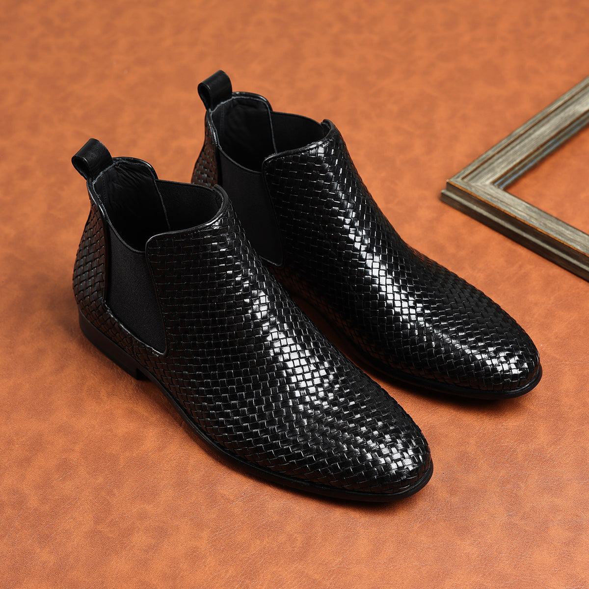 Black woven leather chelsea boots with side elastic panels and low block heel