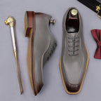 Gray chunky lug-sole brogue Oxford shoe with dark brown outsole, side profile
