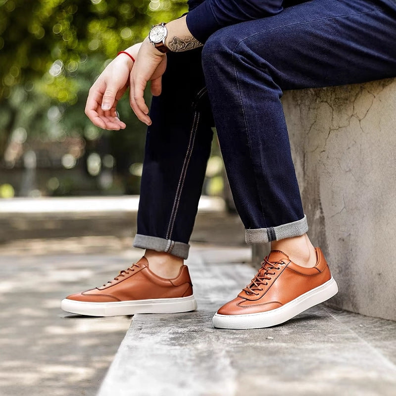 Brown leather lace-up sneakers with white outsole edge detail
