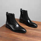 Black leather ankle boots with side zip and thick sole, pair view from side