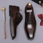 Men's chunky lug sole wingtip brogue oxford shoes in dark brown, side and front angle view.