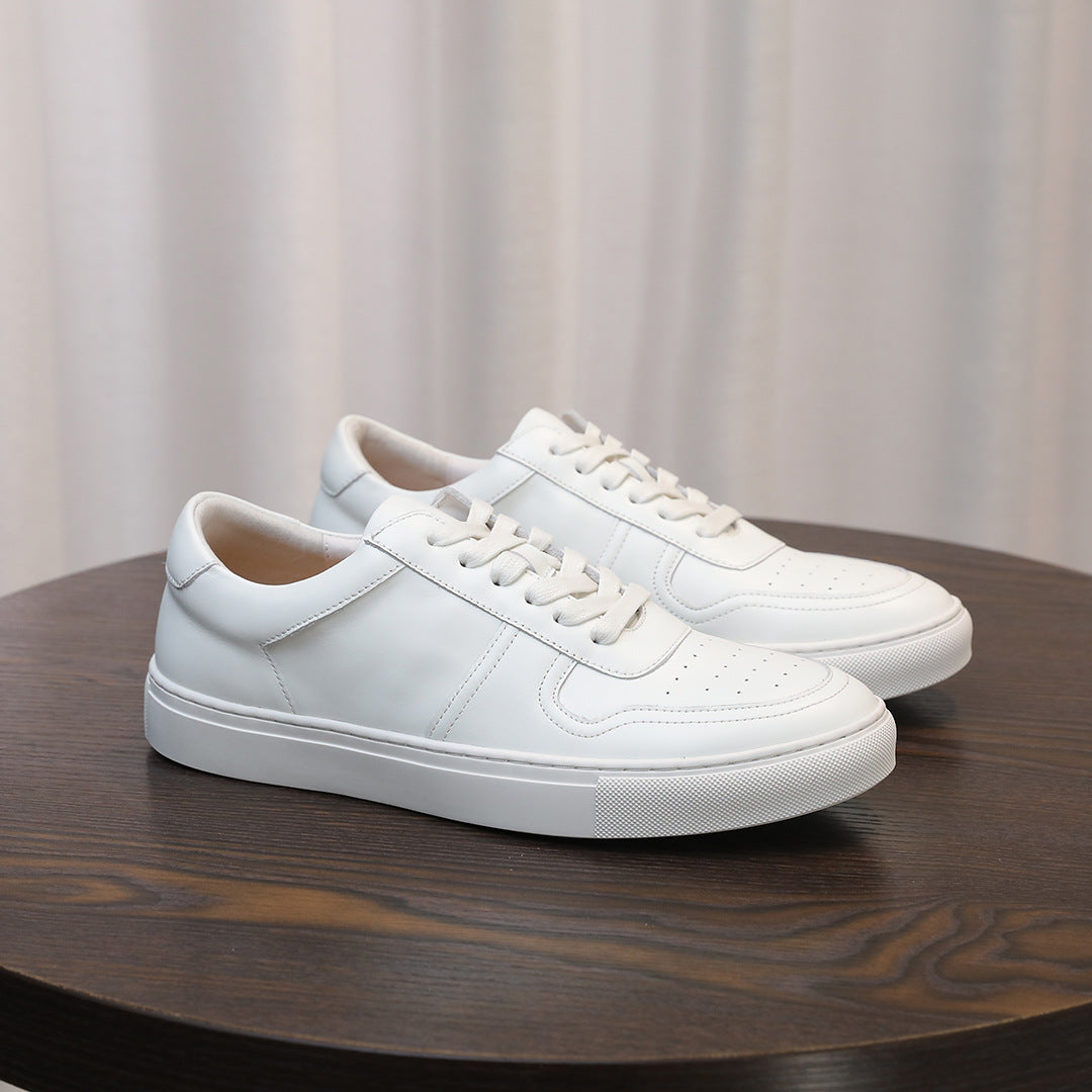 White men's leather sneakers, side view, lace-up design with stitched panels