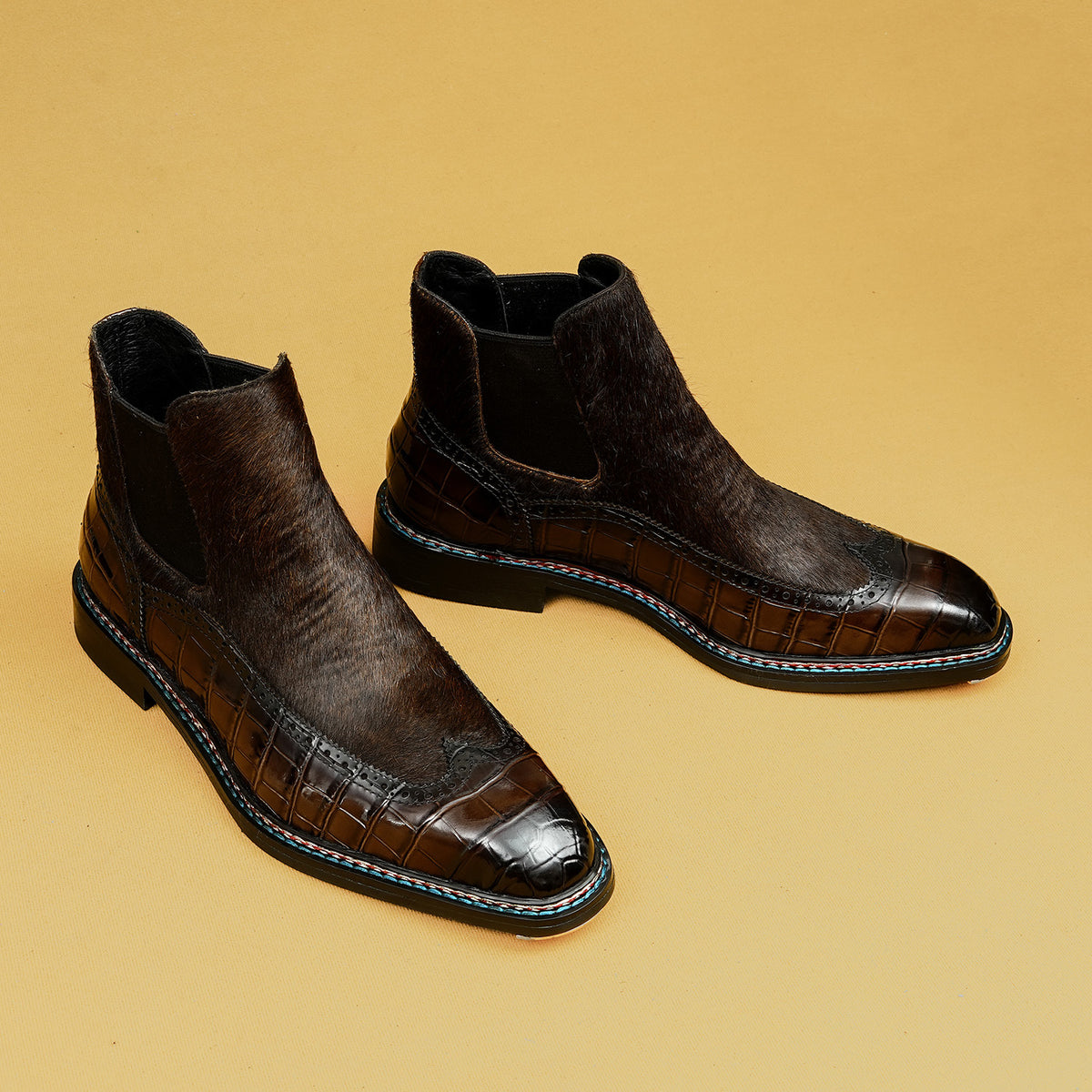 Dark brown leather chelsea dress boots with elastic side panels and glossy toe trim