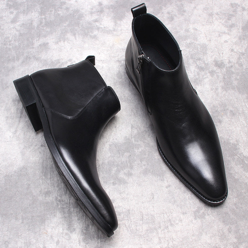 Men's black leather ankle boots with side zip and thick sole, overhead pair view