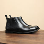 Men's black leather chelsea dress boots, smooth leather upper with elastic side panels.