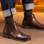 Dark brown leather pointed-toe side-zip dress boot, tan welt, worn with dark pants