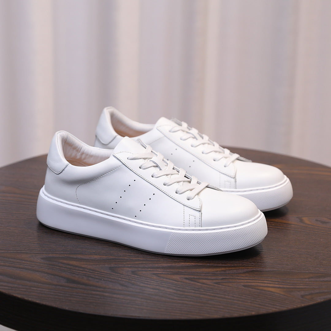 Men's leather sneakers, white, front view with lace-up closure and stitched leather panels