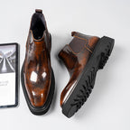 Dark brown leather Chelsea dress boots with elastic gore and thick tread sole view