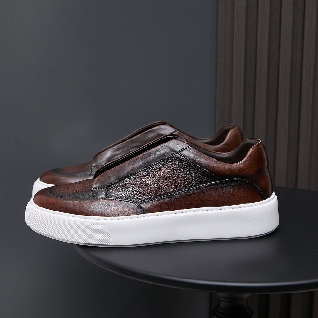 Dark brown genuine leather low-top sneakers with stitched side panel and white rubber sole